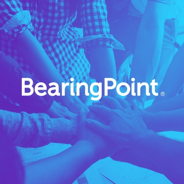 Several hands stacked together symbolizing teamwork, with the white text “BearingPoint” overlaid – partner of BSI Software.
